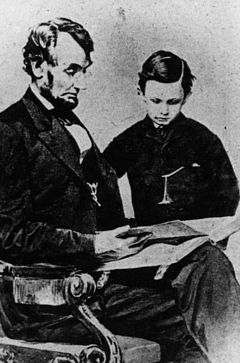 Abraham Lincoln and son reading a book
